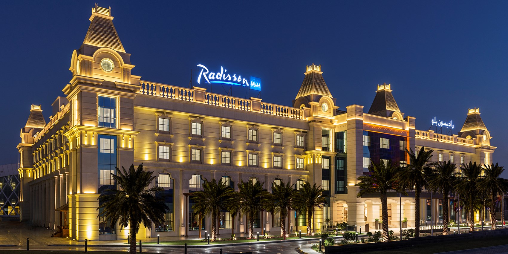 radissonbluajman-facade-night.jpg